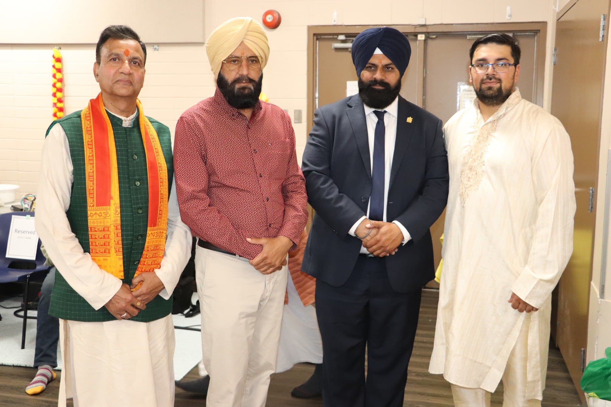 Community leaders, including members of the Sikh community, at the event