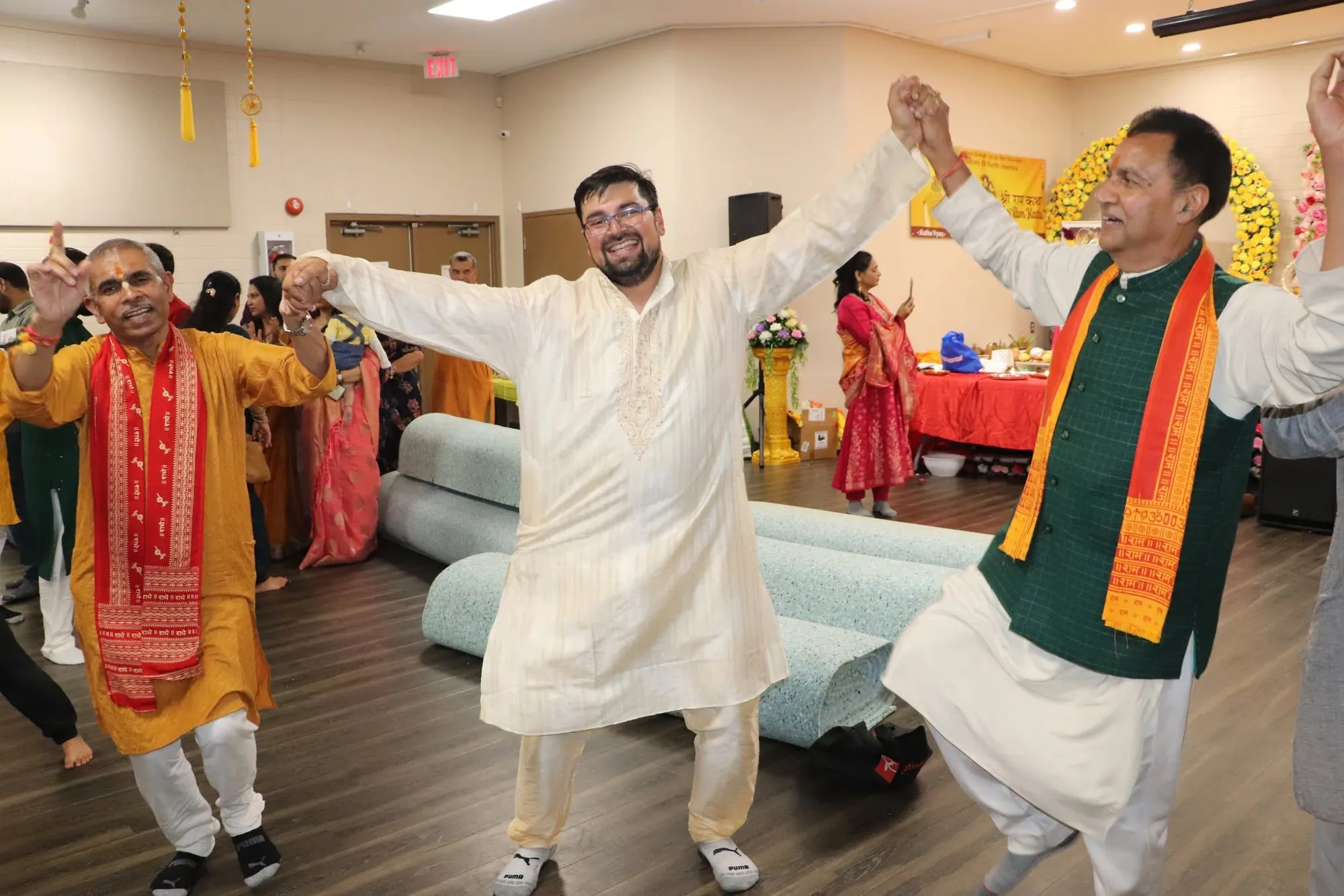 Two devotees dancing during the celebration