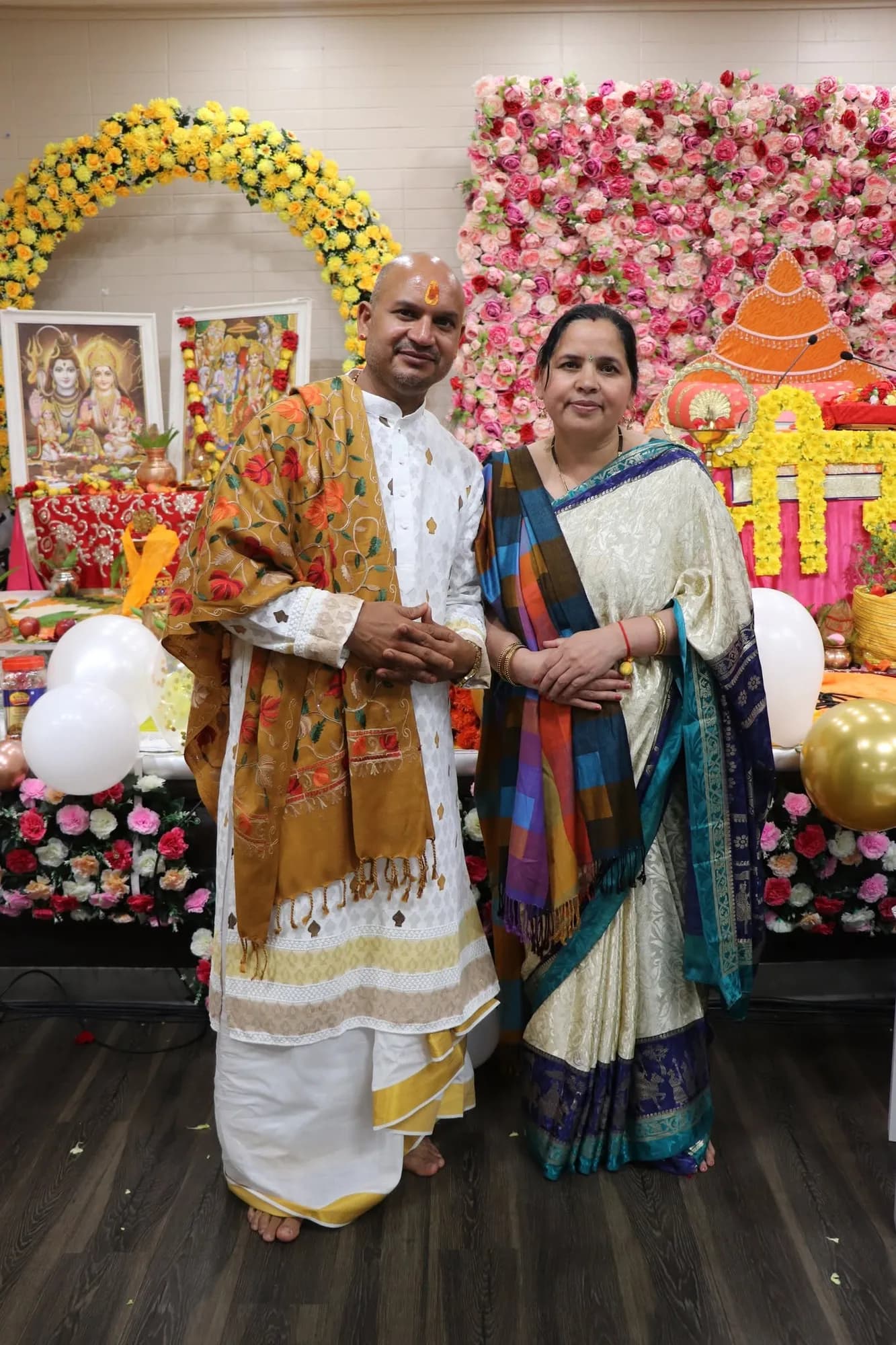 A family posing near the mandap during the Shri Ram Katha