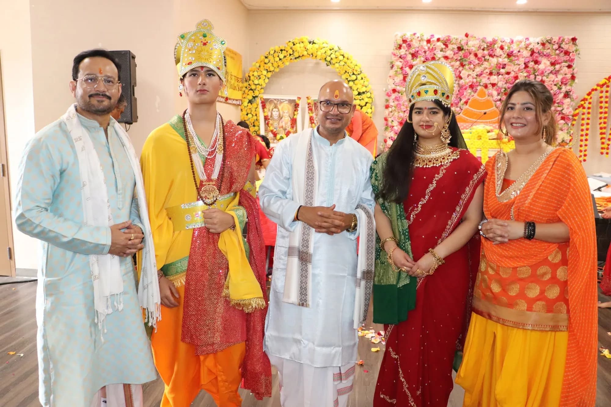 Performers dressed as Shri Ram, Sita, and Lakshman with organisers