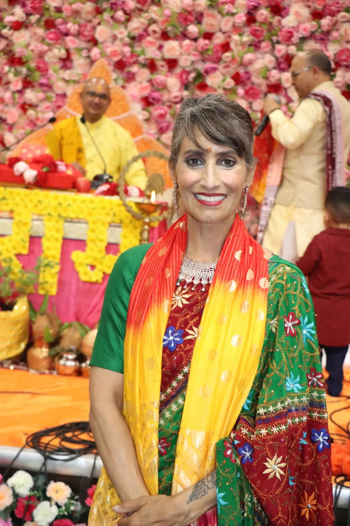 A visiting dignitary honoured with a saffron shawl at the event