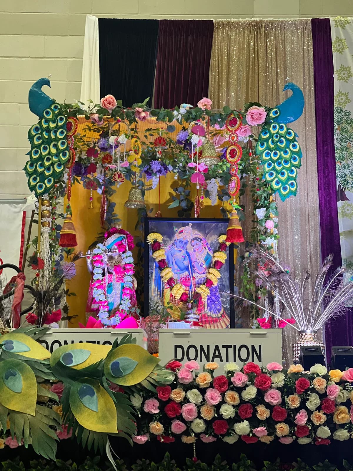 The decorated shrine with the deities and peacock ornaments