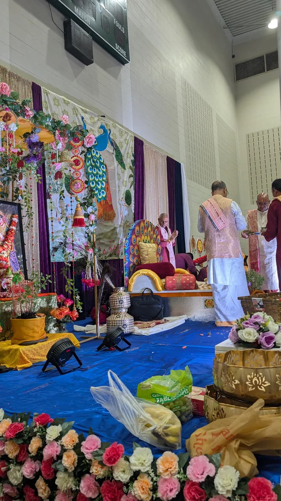 The Katha Vyas leads the puja at the flower-decked mandap