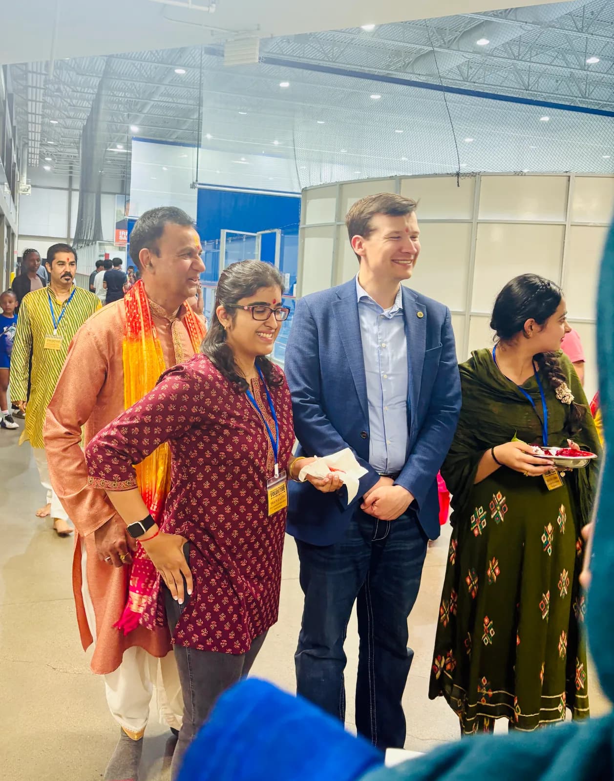 Community organisers welcome a visiting guest
