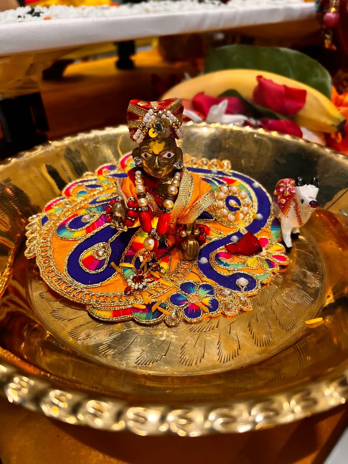 Laddu Gopal adorned in a decorated thali