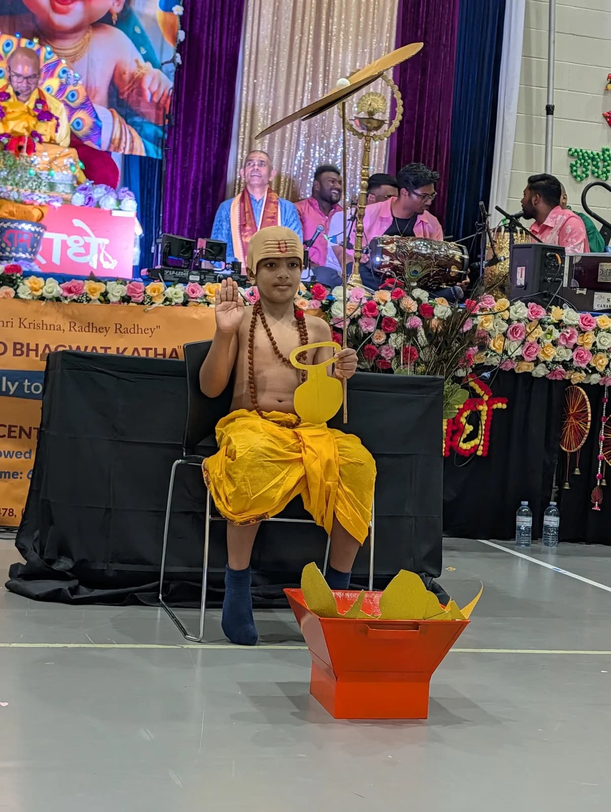 A child dressed as the infant Krishna on the evening of Krishna Janm