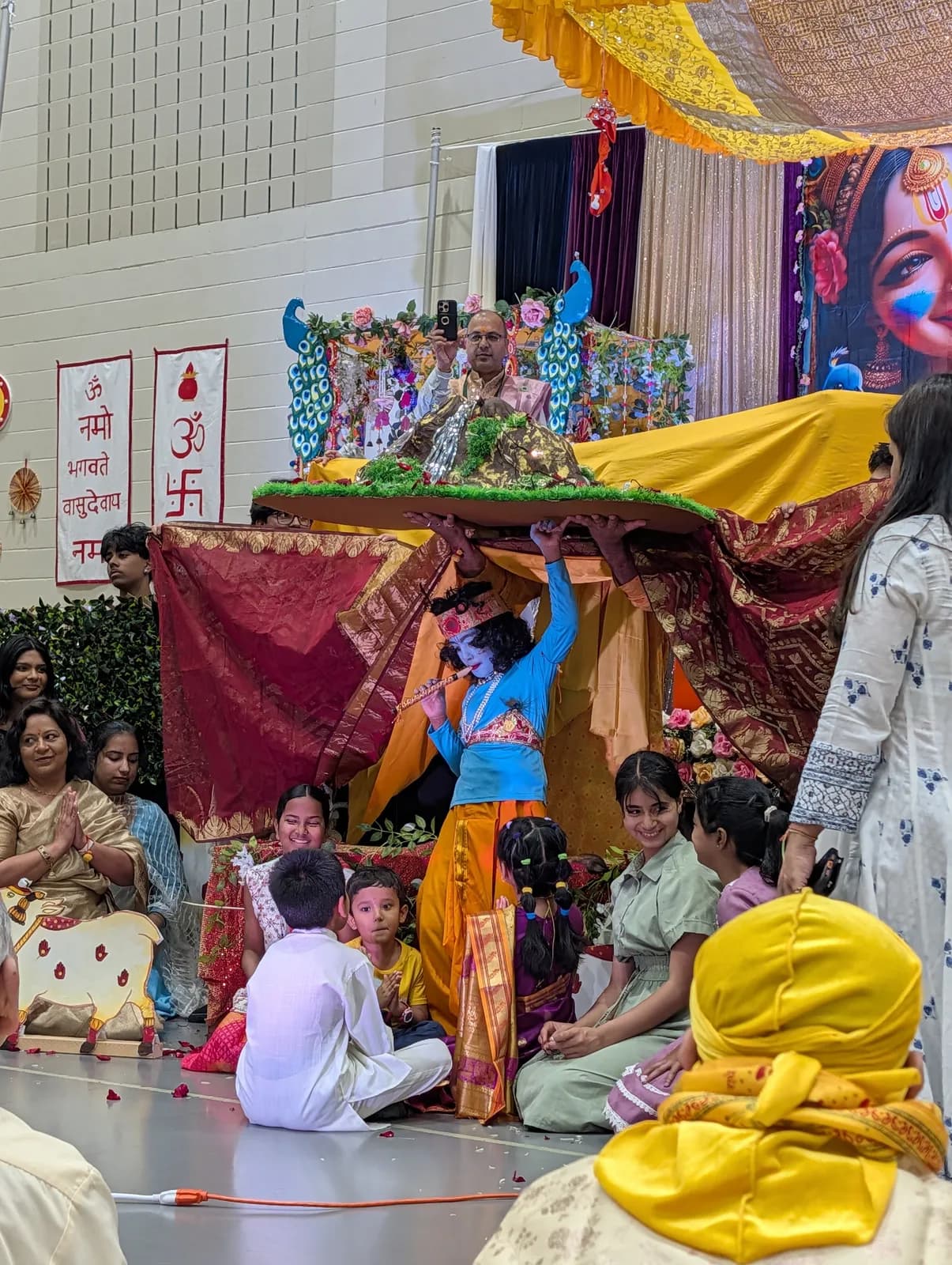 The Govardhan Leela unfolds before the sangat