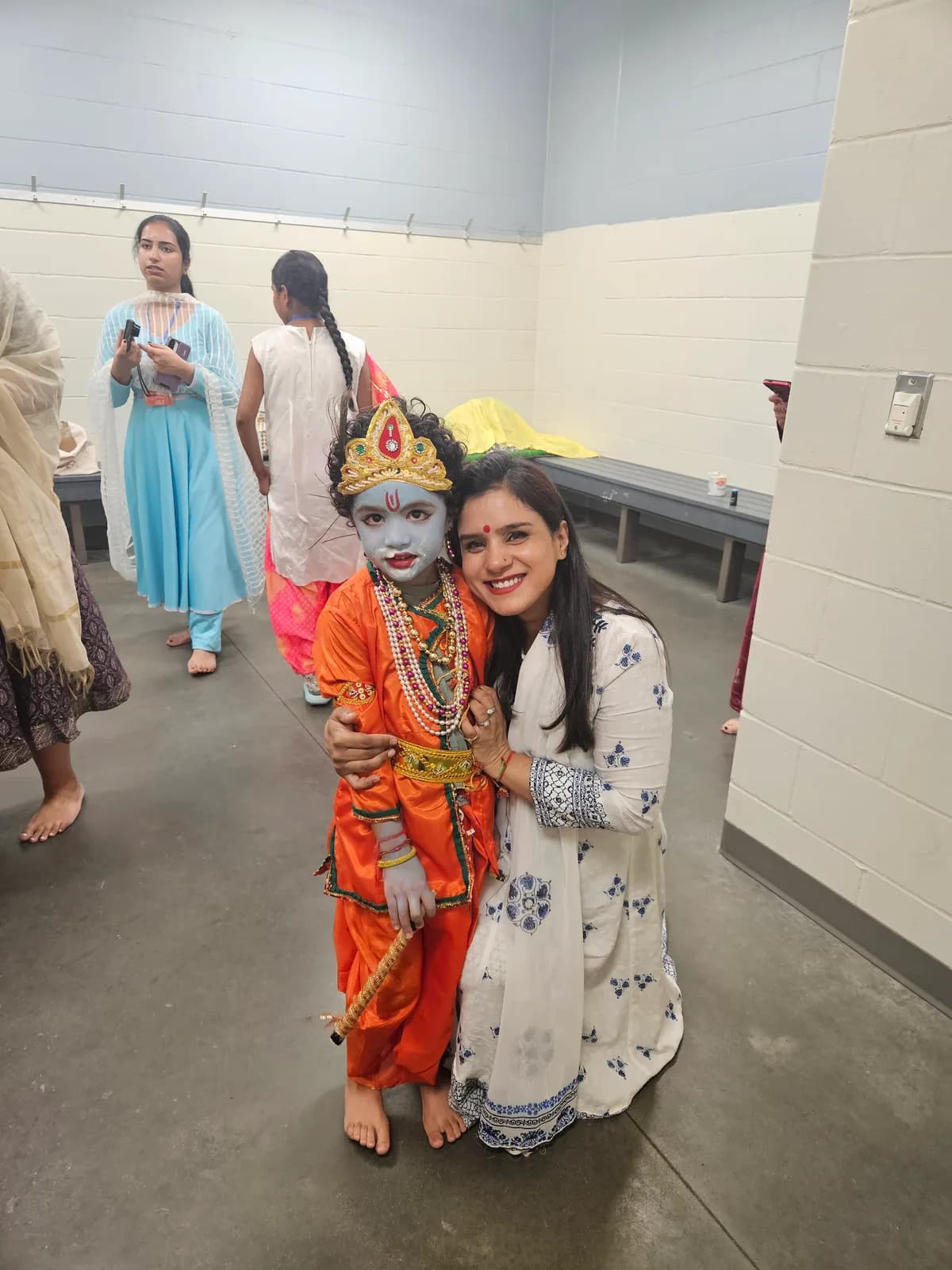 A young Krishna with a devotee