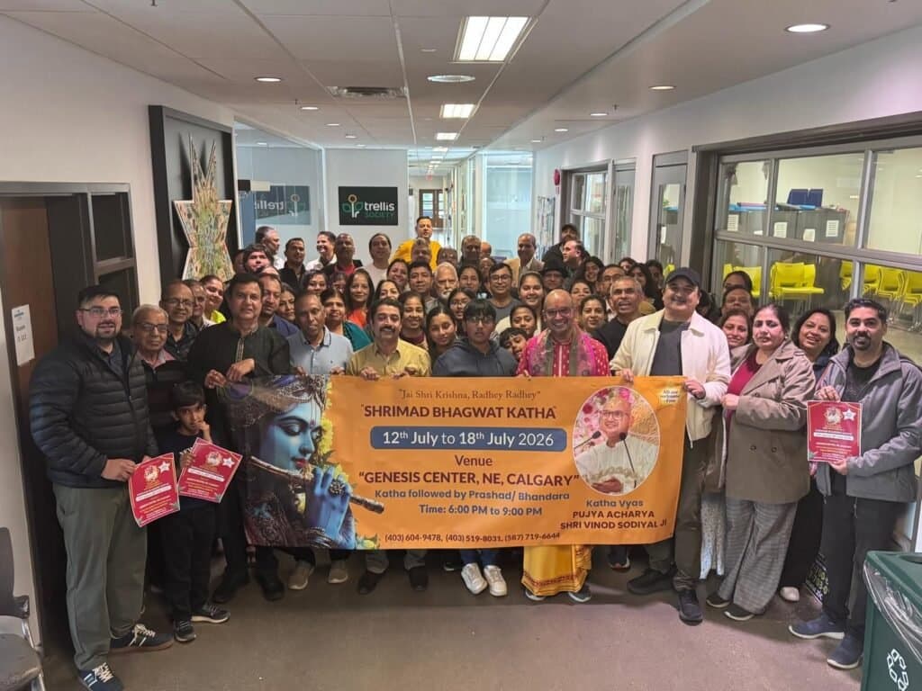 The HSNA community gathered with the Shrimad Bhagwat Katha banner at the Genesis Centre, Calgary